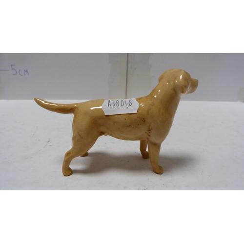 226 - Pair of Beswick small wally dogs, Beswick figure of a cow and a Beswick figure of a dog.  (4)