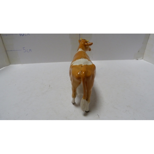 226 - Pair of Beswick small wally dogs, Beswick figure of a cow and a Beswick figure of a dog.  (4)