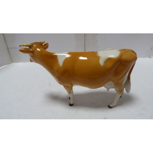 226 - Pair of Beswick small wally dogs, Beswick figure of a cow and a Beswick figure of a dog.  (4)