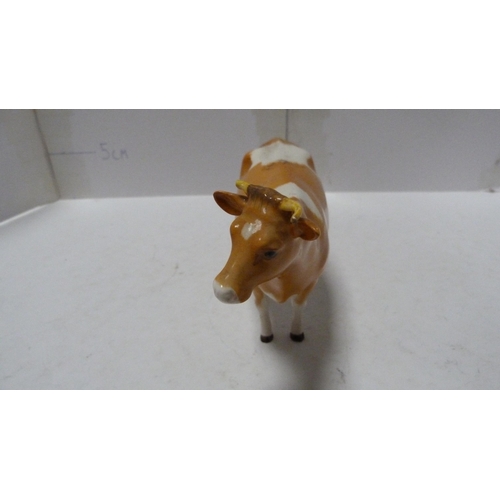 226 - Pair of Beswick small wally dogs, Beswick figure of a cow and a Beswick figure of a dog.  (4)