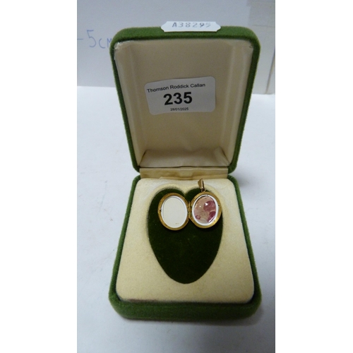 235 - 9ct gold oval locket, 3.3g.