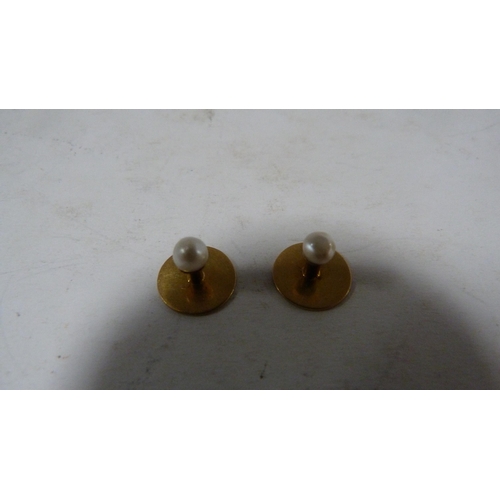 239 - Set of four 9ct gold-mounted dress studs, 4.7g gross.