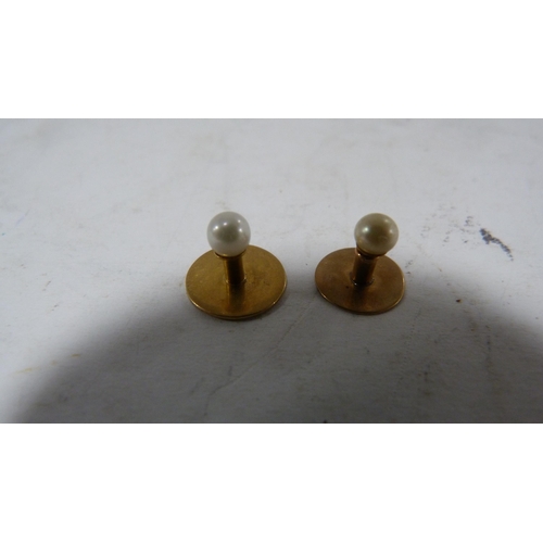 239 - Set of four 9ct gold-mounted dress studs, 4.7g gross.