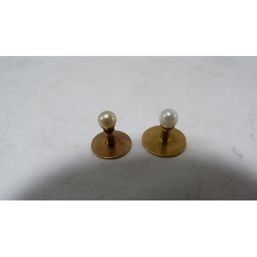 239 - Set of four 9ct gold-mounted dress studs, 4.7g gross.