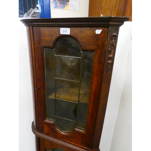 275 - Oak corner cabinet with glazed doors.