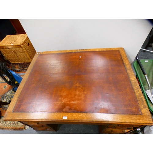 285 - 1930s oak partner's desk with skiver to the top.