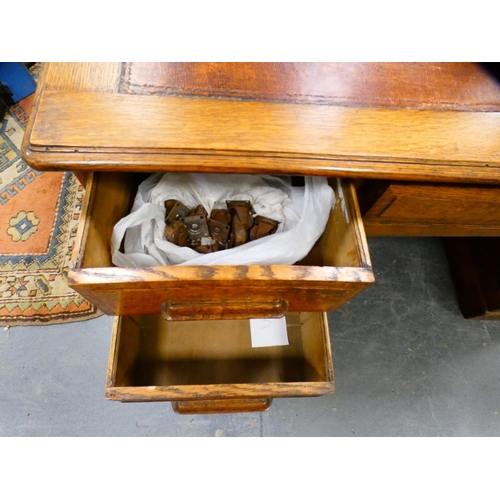 285 - 1930s oak partner's desk with skiver to the top.