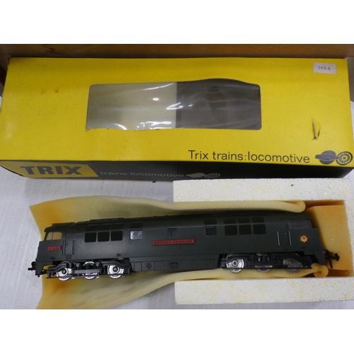 29 - Two boxes containing assorted rolling stock etc., and a Trix Train Western Crusader loco.