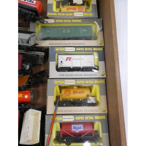 29 - Two boxes containing assorted rolling stock etc., and a Trix Train Western Crusader loco.