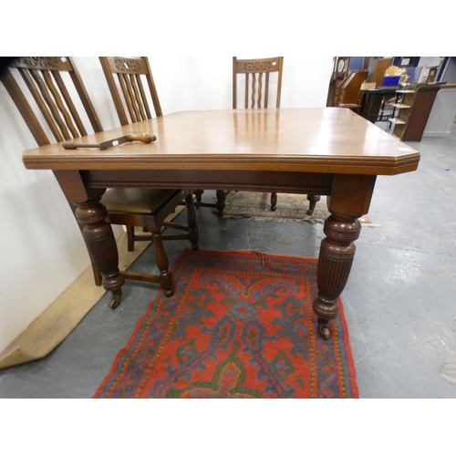 294 - Mahogany extending dining table with two additional leaves.