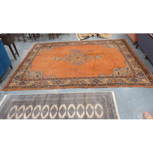 295 - Turkish wool carpet on a rust ground, with green, blue and rust border.