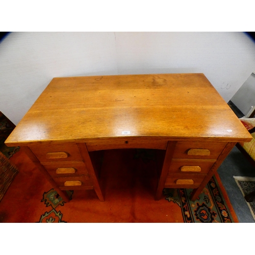 296 - Golden oak kneehole desk.