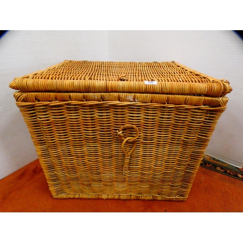 298 - Wicker laundry basket containing some plastic tubs.