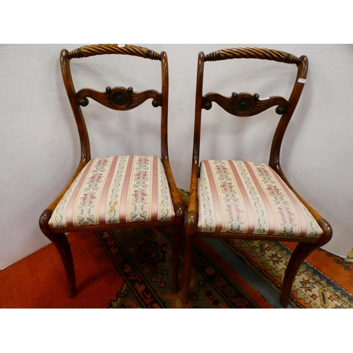 299 - Pair of early 19th century dining chairs with drop-in seats, on sabre supports.