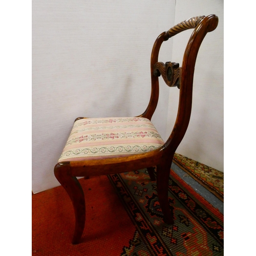 299 - Pair of early 19th century dining chairs with drop-in seats, on sabre supports.