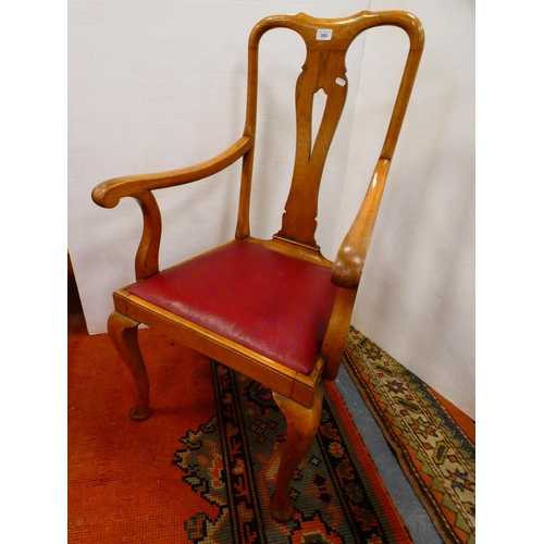 300 - Oak elbow chair and a Regency-style mahogany dining chair.  (2)