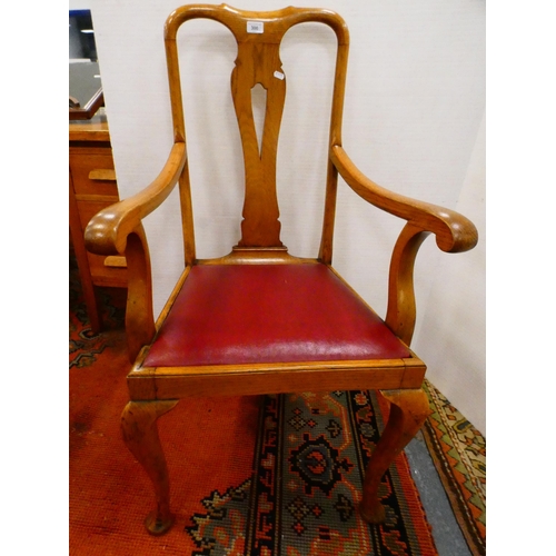 300 - Oak elbow chair and a Regency-style mahogany dining chair.  (2)