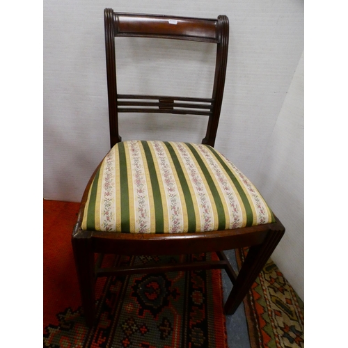 300 - Oak elbow chair and a Regency-style mahogany dining chair.  (2)