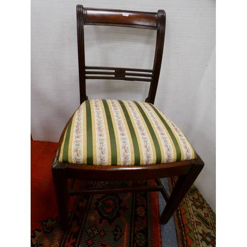 300 - Oak elbow chair and a Regency-style mahogany dining chair.  (2)