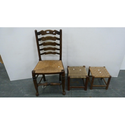 312 - Rush-seated ladder-back antique chair and two woven stools.  (3)