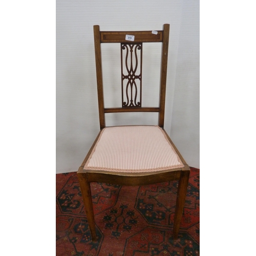 319 - Mahogany and crossbanded side chair with pierced fretwork splat, on square tapering supports.