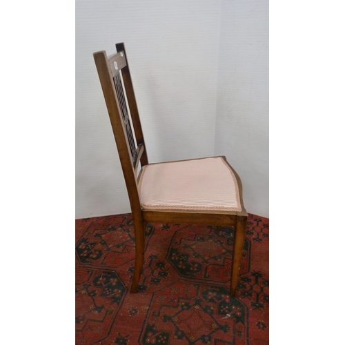 319 - Mahogany and crossbanded side chair with pierced fretwork splat, on square tapering supports.