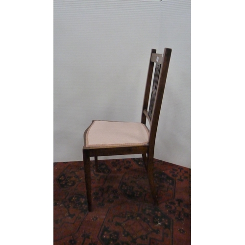 319 - Mahogany and crossbanded side chair with pierced fretwork splat, on square tapering supports.