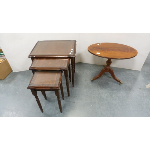 322 - Reproduction oval occasional table on tripod supports and a nest of three tables.