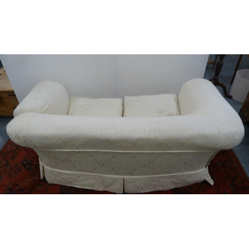 328 - Upholstered two-seater sofa on bun feet and a pair of upholstered armchairs.  (3)