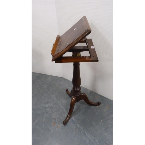 333 - Victorian rosewood music stand on turned column and tripod base.