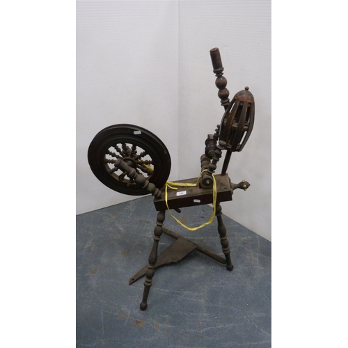 335 - 17th century-style spinning wheel.