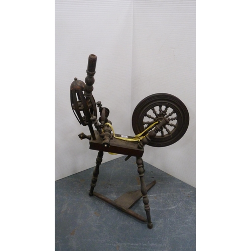 335 - 17th century-style spinning wheel.