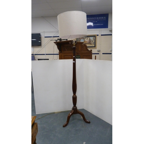 337 - Mahogany floor lamp on tripod base with shade.