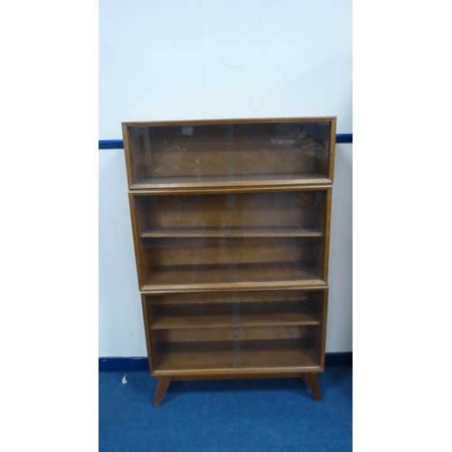 341 - Vintage walnut sectional bookcase by Beresford & Hicks, with glazed sliding doors.