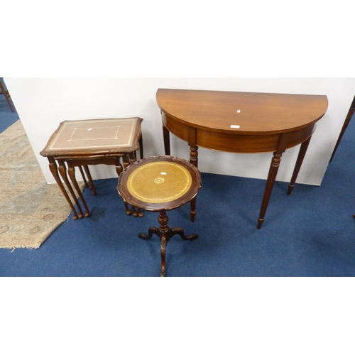 347 - Demi-lune table on fluted supports, nest of three tables with brown skivers and glass tops, on pad f... 