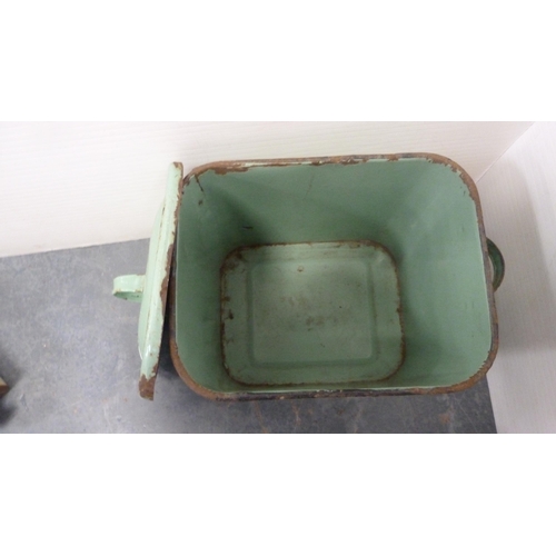 351 - Green enamel bread bin and cover, large metal kitchen jug and two stoneware pigs.  (4)