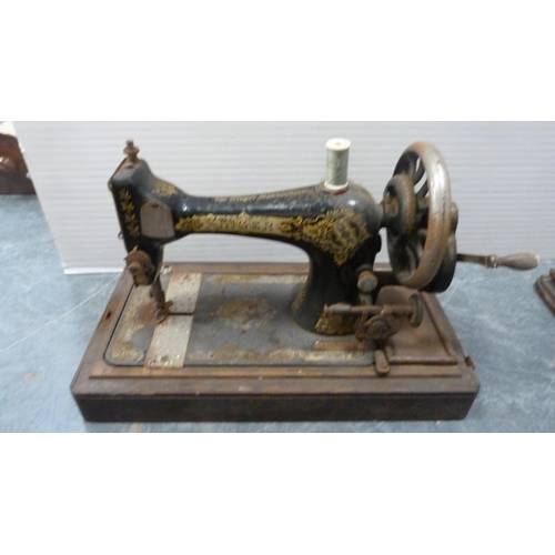 352 - Three portable Singer sewing machines.