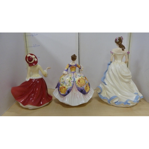 39 - Three Royal Doulton figures, 'Christmas Day 2009', 'Christine' HN 4930 with certificate, and 'Key To... 