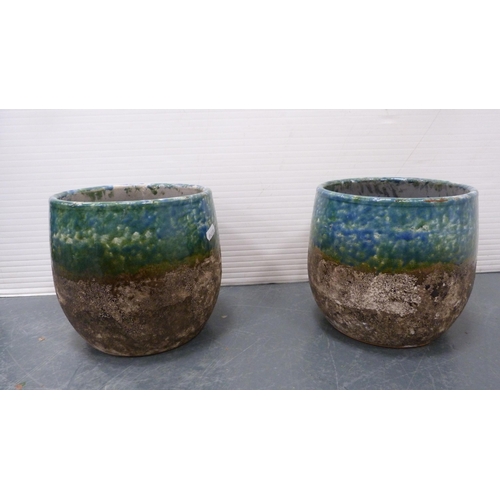 58 - Three glass demi johns and a pair of reproduction studio pottery planters.  (5)