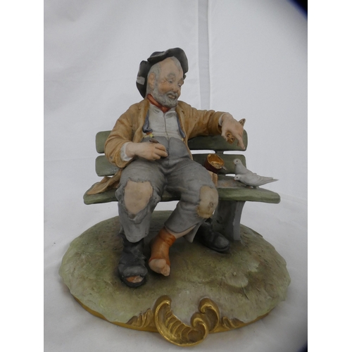 75 - Country Artists CA506 swan family group and a Capodimonte model of a tramp on a bench.  (2)