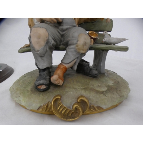 75 - Country Artists CA506 swan family group and a Capodimonte model of a tramp on a bench.  (2)