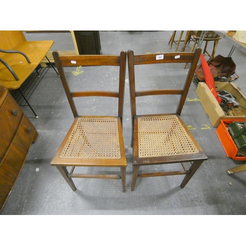 490 - Two mahogany cane seated chairs.