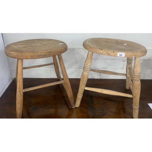 690 - Two oak stools (2)