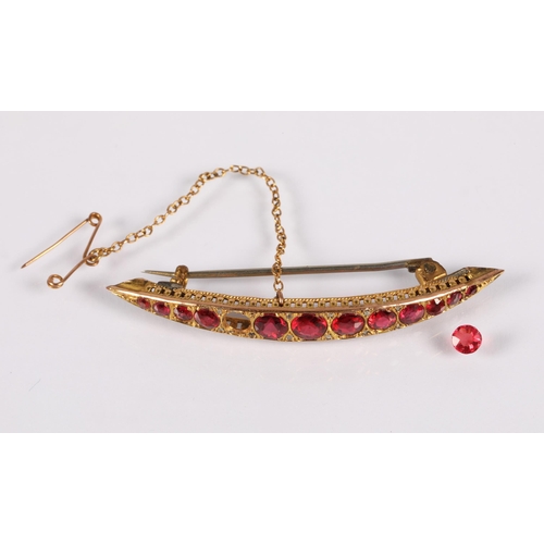 100 - 9ct gold bar brooch set with graduated ruby coloured gemstones interspersed with diamond chips, one ... 