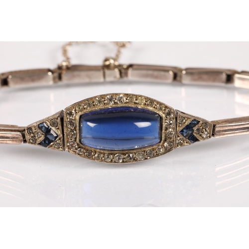 102 - Silver bracelet set with a large blue gemstone surrounded by white and smaller blue, gross weight 10... 