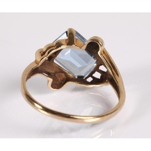 126 - 9ct gold ring set with a blue colour gemstone, ring size R, 3.2g