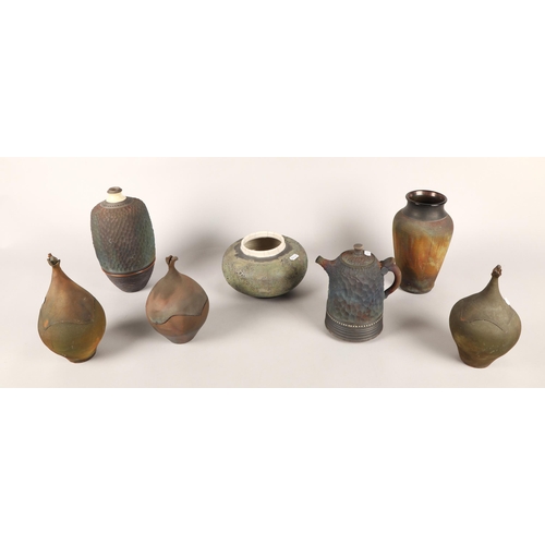 283 - Seven pieces of Studio Pottery to include Don Nibert Raku ware, vases, tea pot etc.  (7)