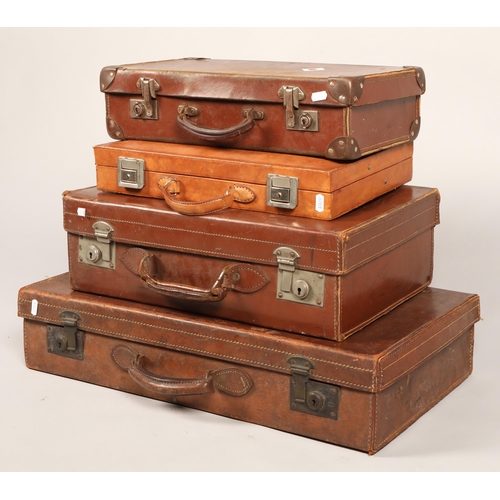 516 - Four leather vintage travel cases graduating in size