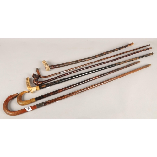 517 - Six assorted walking canes, some with silver collars (6)