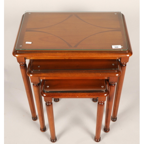 566 - Mahogany nest of three tables with glass inserts